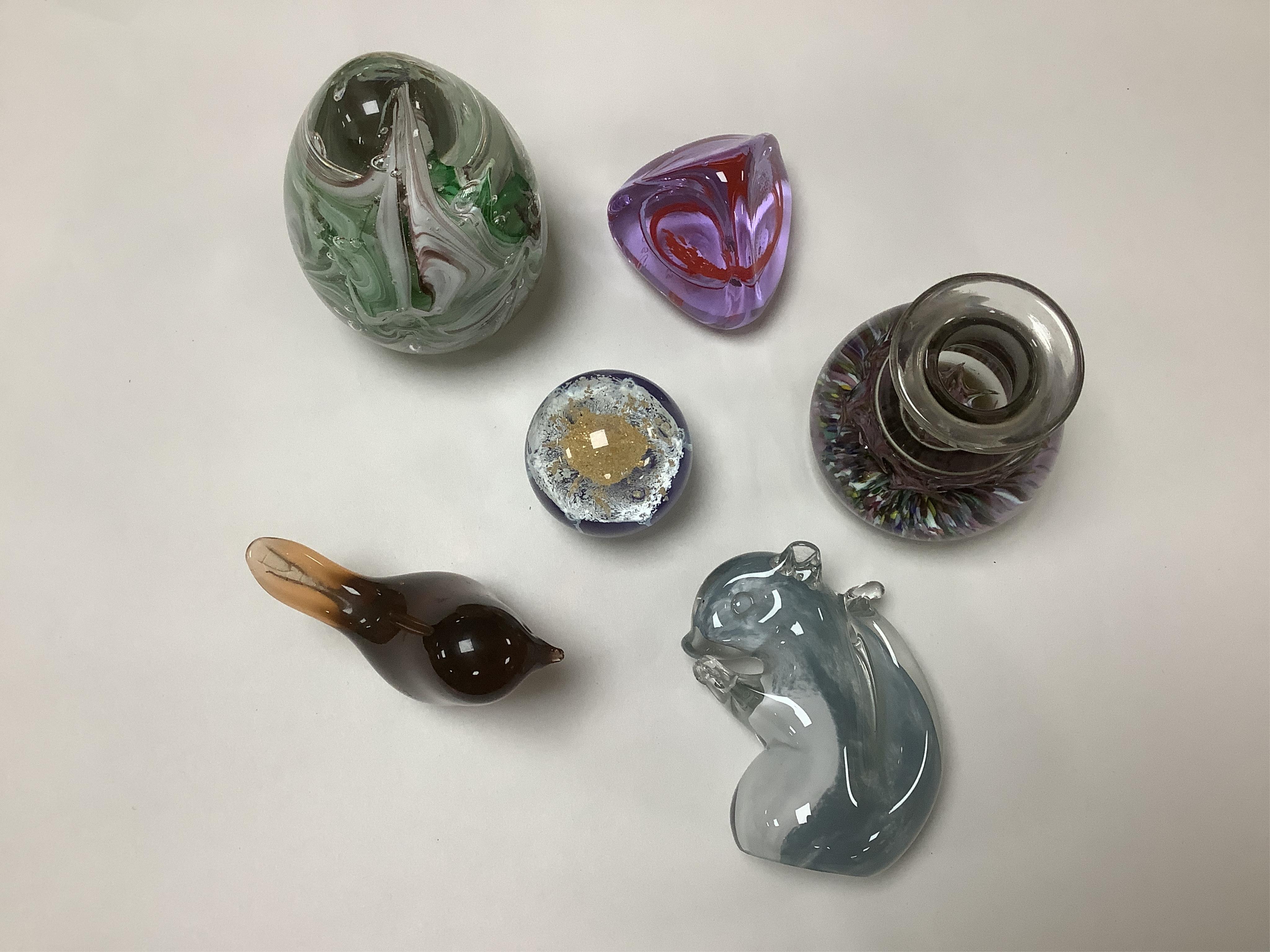 Twenty three glass paperweights, including five with silhouettes of animals, and others of unusual shape. Condition - good